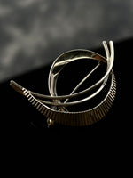 Sculptural brooch