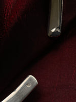 Minimalist torque with closed sculptural form