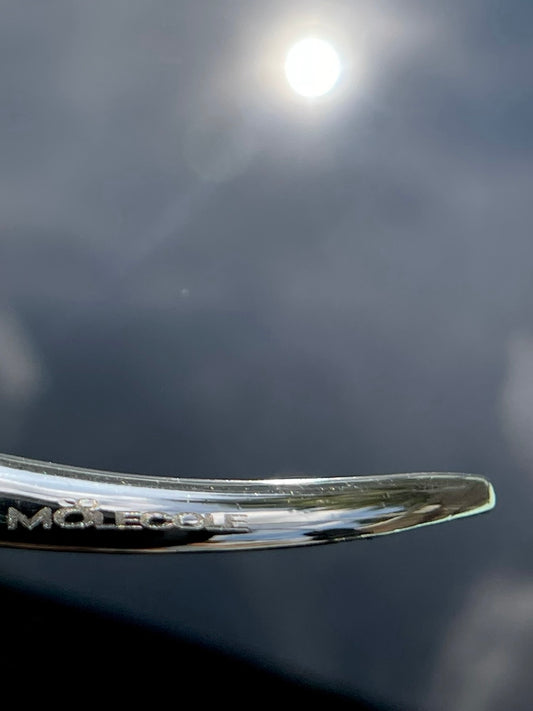 Sculptural necklace with white cabochon