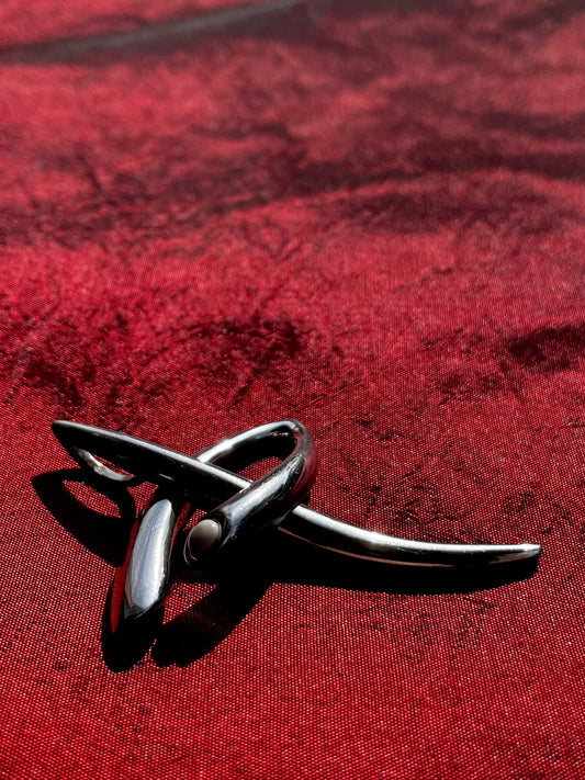 Sculptural necklace with white cabochon