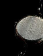 Irridescent silver bangle mechanical watch