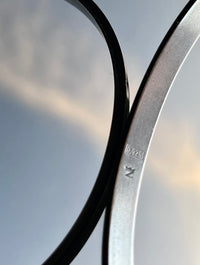 Irridescent silver bangle mechanical watch